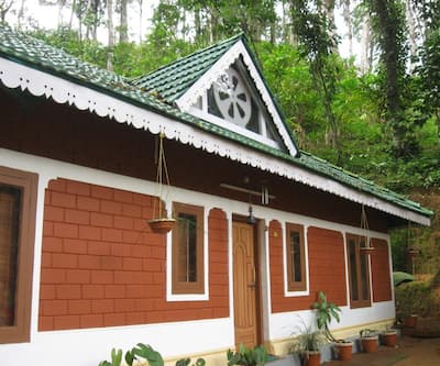 https://imgcld.yatra.com/ytimages/image/upload/t_hotel_yatra_city_desktop/v1431953279/Domestic Hotels/Hotels_Munnar/Ela Ecoland/Exterior.jpg